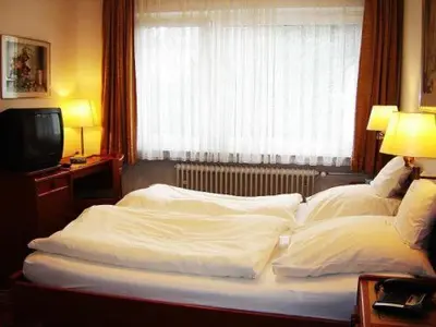 Ein Bett oder Betten in einem Zimmer der Unterkunft Hotel - Restaurant Reher Hof