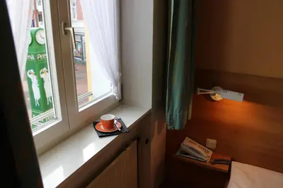 Ein Bett oder Betten in einem Zimmer der Unterkunft An der Persiluhr Stadt-gut-Hotel
