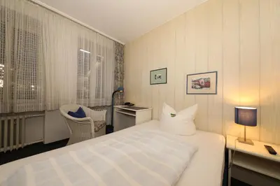 Ein Bett oder Betten in einem Zimmer der Unterkunft Hotel Am Ehrenhof