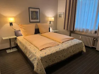 Ein Bett oder Betten in einem Zimmer der Unterkunft Hotel Am Ehrenhof
