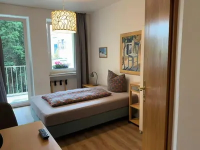 Ein Bett oder Betten in einem Zimmer der Unterkunft Hotel Am Ehrenhof