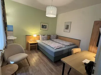 Ein Bett oder Betten in einem Zimmer der Unterkunft Hotel Am Ehrenhof