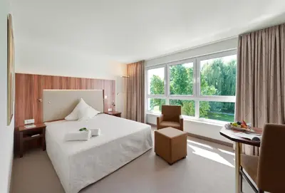 Ein Bett oder Betten in einem Zimmer der Unterkunft Ringhotel Am Stadtpark