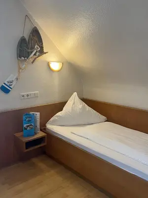 Ein Bett oder Betten in einem Zimmer der Unterkunft Aal-Kate