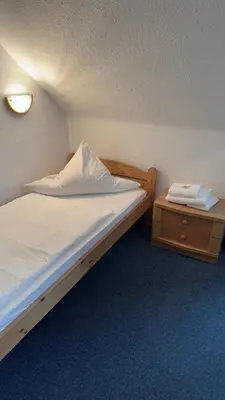 Ein Bett oder Betten in einem Zimmer der Unterkunft Aal-Kate