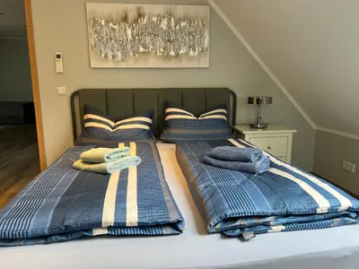 Ein Bett oder Betten in einem Zimmer der Unterkunft Ferienwohnungen Margot
