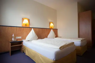 Ein Bett oder Betten in einem Zimmer der Unterkunft Hotel Haus Union
