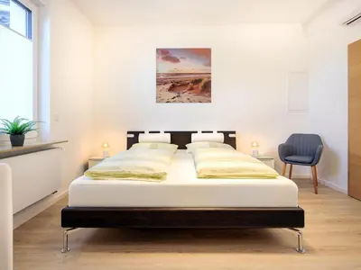 Ein Bett oder Betten in einem Zimmer der Unterkunft Modern Home Check-in & chill down auf 65 qm²