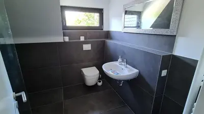 Ein Badezimmer in der Unterkunft Warzalas Apartement