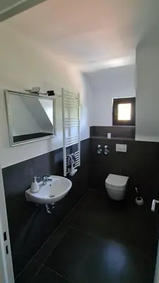 Ein Badezimmer in der Unterkunft Warzalas Apartement