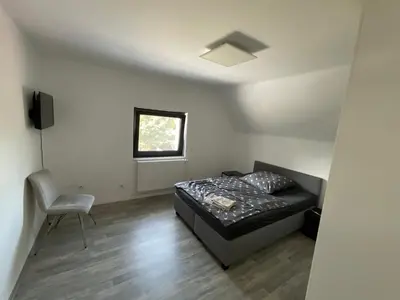 Ein Bett oder Betten in einem Zimmer der Unterkunft Warzalas Apartement