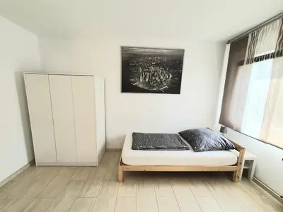 Ein Bett oder Betten in einem Zimmer der Unterkunft Pottmensch Oberhausen