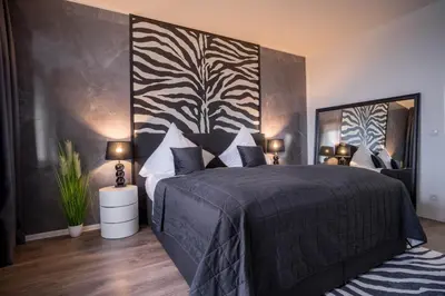 Ein Bett oder Betten in einem Zimmer der Unterkunft RüSuite II - Gemütliches Apartment in Rüttenscheid
