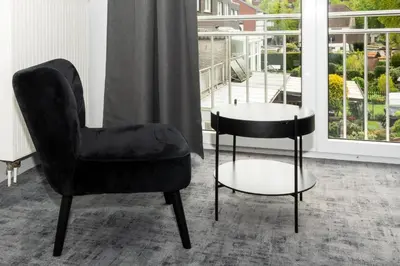 Ein Sitzbereich in der Unterkunft Hotel Deluxe