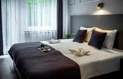 Ein Bett oder Betten in einem Zimmer der Unterkunft M&M Löwen Hotel