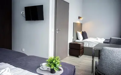 Ein Bett oder Betten in einem Zimmer der Unterkunft M&M Löwen Hotel