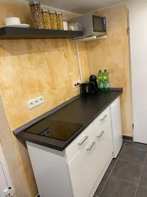 Küche/Küchenzeile in der Unterkunft Wohnen direkt an der Rheinpromenade mit Whirlpool und Sauna
