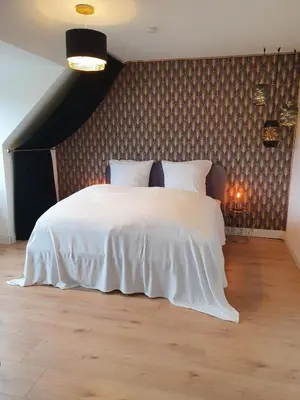 Ein Bett oder Betten in einem Zimmer der Unterkunft Melody Apartment mit E-Ladesäule und mobiler Klimaanlage
