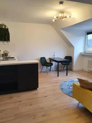 Ein Sitzbereich in der Unterkunft Melody Apartment mit E-Ladesäule und mobiler Klimaanlage