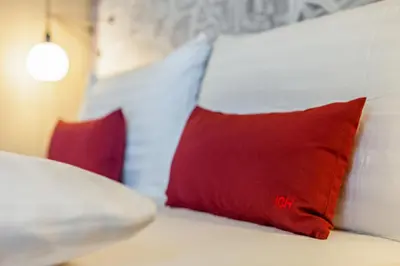 Ein Bett oder Betten in einem Zimmer der Unterkunft IntercityHotel Dortmund