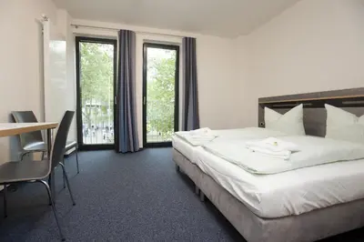 Ein Bett oder Betten in einem Zimmer der Unterkunft Jugendherberge Duisburg Sportpark