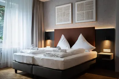 Ein Bett oder Betten in einem Zimmer der Unterkunft JUNIK Apartments Oberhausen