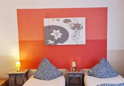 Ein Bett oder Betten in einem Zimmer der Unterkunft ELENA flat LILIE, Oberhausen Zentrum CentrO Westfield