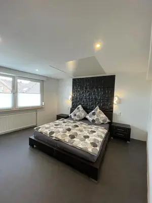 Ein Bett oder Betten in einem Zimmer der Unterkunft My Home Deluxe Ferienwohnung Sauna