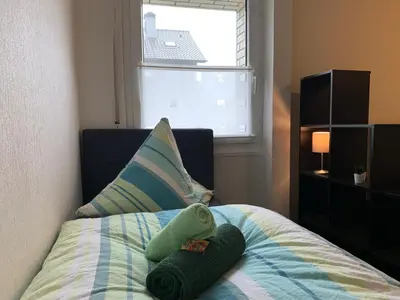Ein Bett oder Betten in einem Zimmer der Unterkunft Dorsten-Ferienwohnung, Hermannstraße