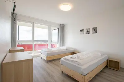 Ein Bett oder Betten in einem Zimmer der Unterkunft T&K Apartments Comfortable 3 Room Apartments with Balcony