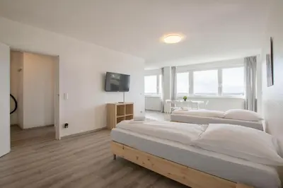 Ein Bett oder Betten in einem Zimmer der Unterkunft T&K Apartments Comfortable 3 Room Apartments with Balcony