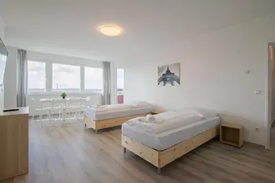 Ein Bett oder Betten in einem Zimmer der Unterkunft T&K Apartments Comfortable 3 Room Apartments with Balcony