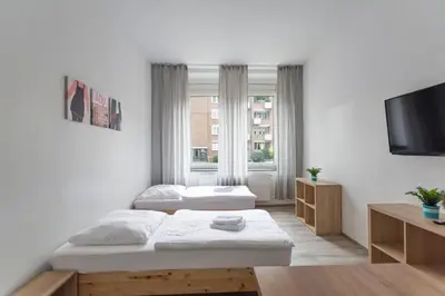Ein Bett oder Betten in einem Zimmer der Unterkunft T&K Apartments - 2 Room Apartment - Ground Floor