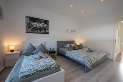 Ein Bett oder Betten in einem Zimmer der Unterkunft HagenStay Eilpe 2