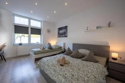 Ein Bett oder Betten in einem Zimmer der Unterkunft HagenStay Eilpe 2