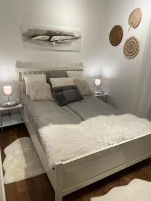 Ein Bett oder Betten in einem Zimmer der Unterkunft Exklusive Villa am Wald mit Garten, Waldzugang und Sauna