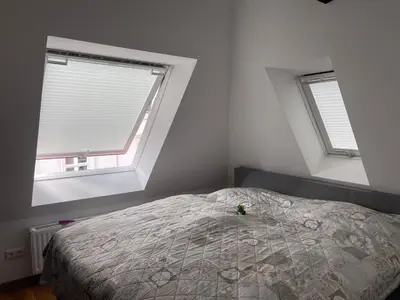 Ein Bett oder Betten in einem Zimmer der Unterkunft Pension Ruhrfrosch