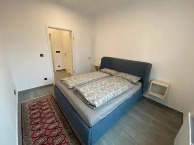 Ein Bett oder Betten in einem Zimmer der Unterkunft Stadtquartier Hoesch