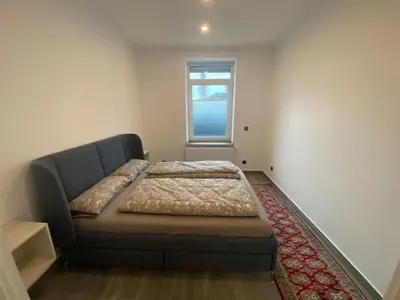 Ein Bett oder Betten in einem Zimmer der Unterkunft Stadtquartier Hoesch