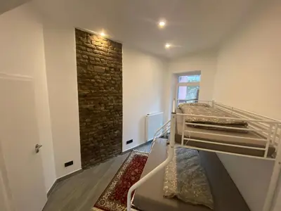 Ein Bett oder Betten in einem Zimmer der Unterkunft Stadtquartier Hoesch