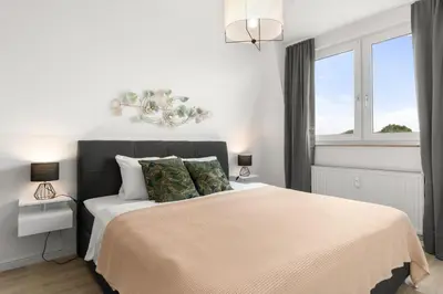 Ein Bett oder Betten in einem Zimmer der Unterkunft Maracoón - Suite Studios 1 Krefeld Uerdingen I 20 Min zur Messe