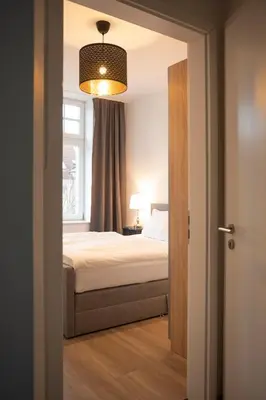 Ein Bett oder Betten in einem Zimmer der Unterkunft JayBnB - Gemütliches Apartment direkt am Hafen von Dortmund