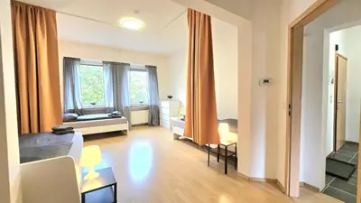 Ein Sitzbereich in der Unterkunft Modern 3-Room Apartment with Winter Garden, Free Parking in Hagen - HA01