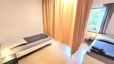 Ein Bett oder Betten in einem Zimmer der Unterkunft Modern 3-Room Apartment with Winter Garden, Free Parking in Hagen - HA01