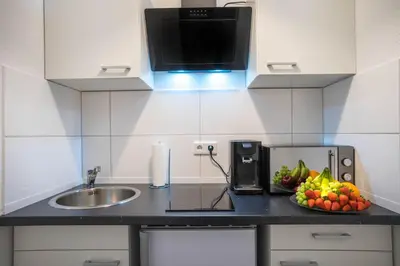 Küche/Küchenzeile in der Unterkunft RüSuite XL I 2-Zimmer Apartment I Balkon I Netflix