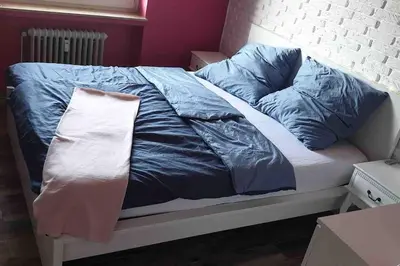 Ein Bett oder Betten in einem Zimmer der Unterkunft Bochum ich komm aus Dir!