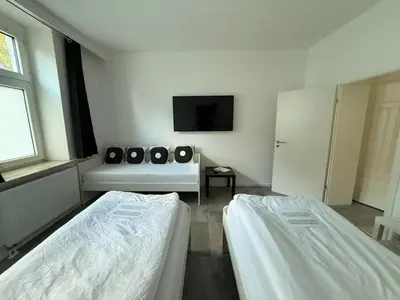 Ein Bett oder Betten in einem Zimmer der Unterkunft Freshly renovated City Apartments Essen KITCHEN WIFI near Düsseldorf Airport