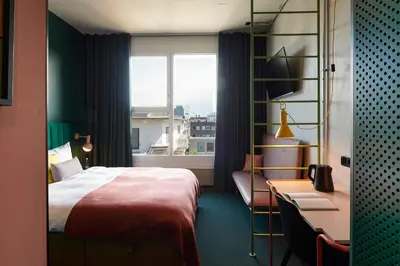 Ein Bett oder Betten in einem Zimmer der Unterkunft Basecamp Hotel Dortmund