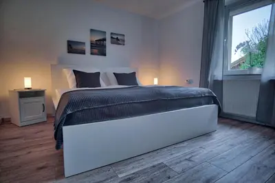 Ein Bett oder Betten in einem Zimmer der Unterkunft Maisonette privater Zugang Waschmaschine Parkplatz