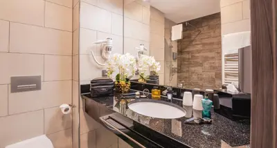Ein Badezimmer in der Unterkunft PLAZA INN Recklinghausen